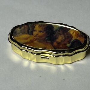 NWOT 3 small metal sewing kits. Sweet kids on top of kit. Perfect for gifts!